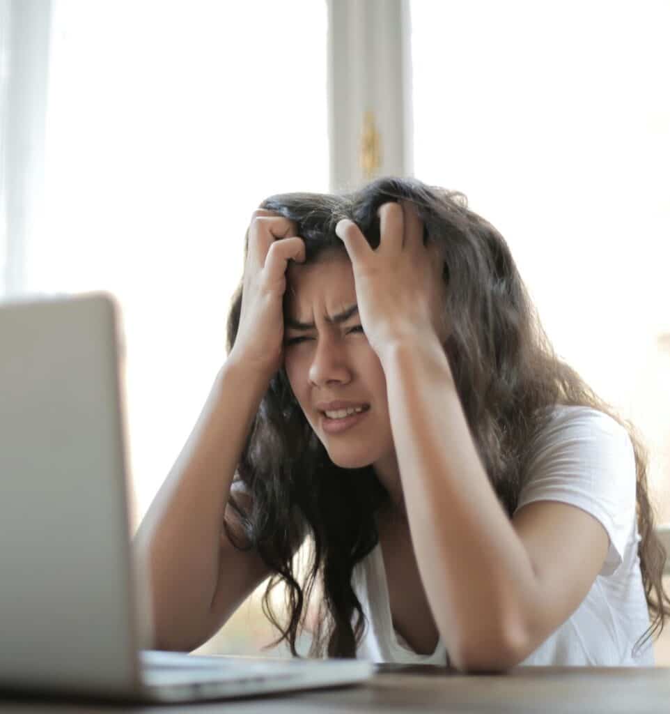 Frustrated female waiting for slow unresponsive IT Support.