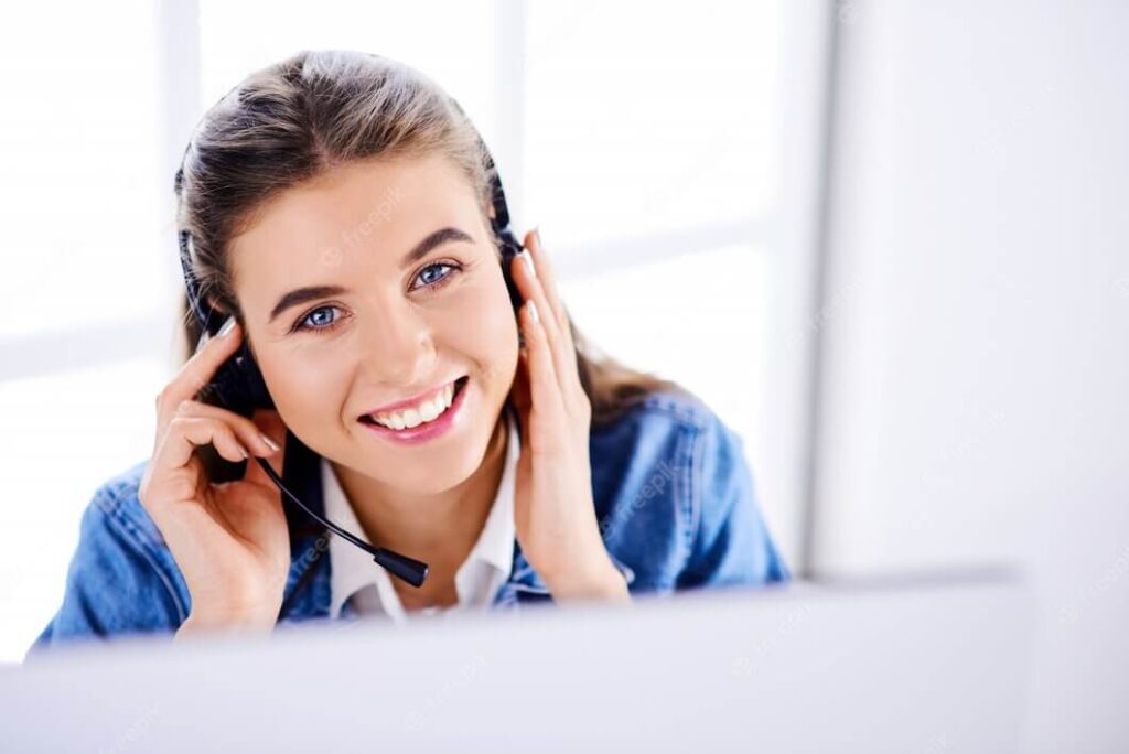 smiling beautiful woman working call at the Next step Help Desk.
